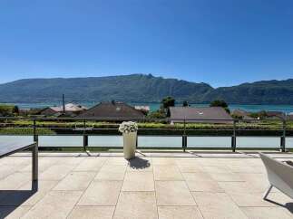 Enjoy breathtaking mountain and lake views from this stunning property's expansive terrace.