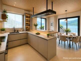 Experience modern living in this stunning kitchen and dining area, featuring sleek cabinetry, a spacious island with integrated lighting, and breathtaking lake and mountain views.