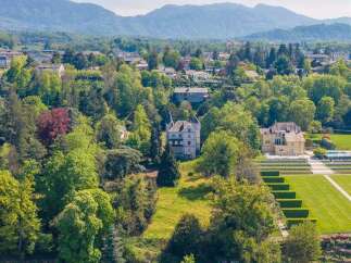 Experience luxury living with this stunning lakeside estate, featuring a private swimming area and meticulously landscaped gardens.