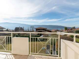 Enjoy breathtaking panoramic views of the lake and mountains from this stunning balcony.