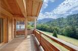 Experience breathtaking mountain views from this charming wooden balcony, perfect for enjoying your morning coffee or evening relaxation.