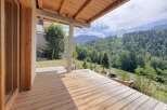 Experience breathtaking mountain views from this stunning wooden deck, perfect for outdoor living.