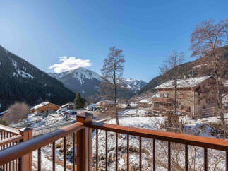 Experience breathtaking mountain views from this charming property, nestled in a picturesque snowy village.