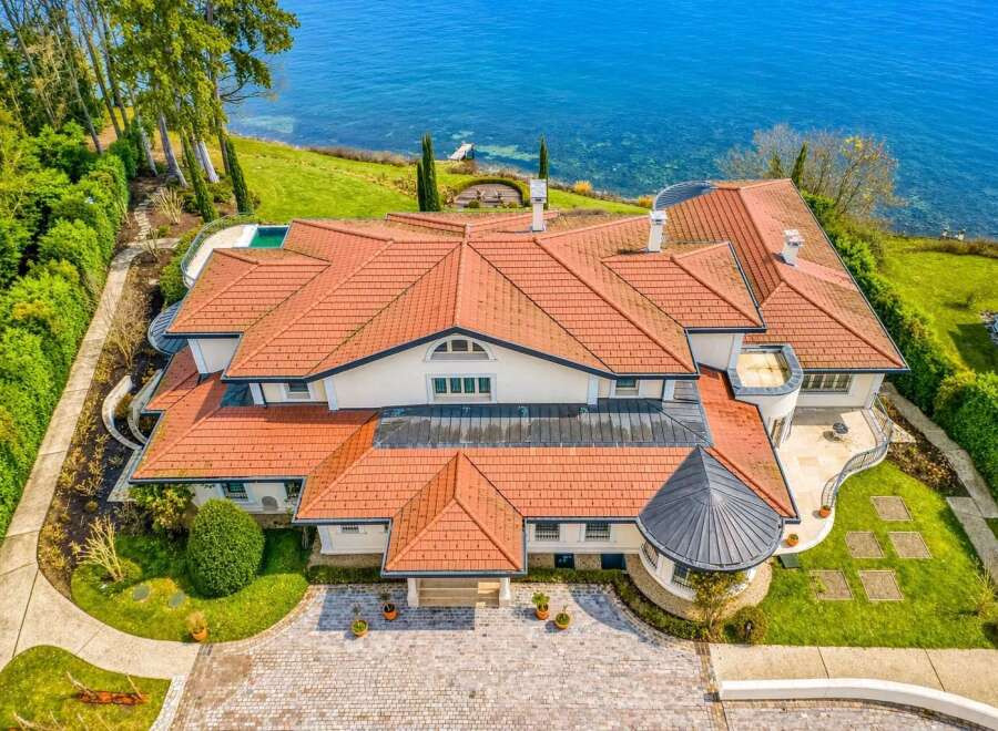 Experience luxury living with this stunning waterfront estate, boasting panoramic ocean views and direct access to the water.