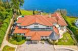 Experience luxury living with this stunning waterfront estate, boasting panoramic ocean views and direct access to the water.