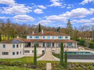 Discover this magnificent property featuring a sprawling estate with a luxurious swimming pool and expansive outdoor living spaces.