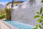 Experience luxury living with this stunning water feature, perfect for creating a serene ambiance in your backyard.