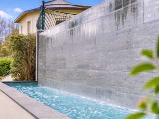 Experience luxury living with this stunning water feature, perfect for creating a serene ambiance in your backyard.