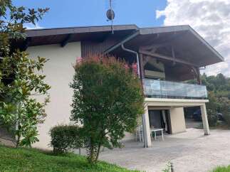 Discover this charming property featuring a spacious balcony with glass railings, perfect for enjoying scenic views.