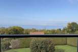 Enjoy breathtaking lake views from this stunning property, offering a serene escape with lush greenery and mature trees.