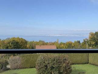 Enjoy breathtaking lake views from this stunning property, offering a serene escape with lush greenery and mature trees.