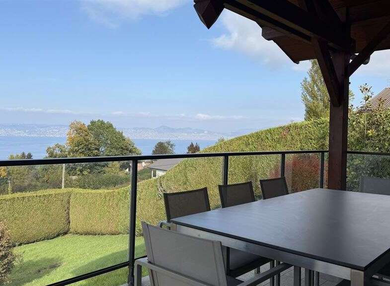 Enjoy breathtaking lake and mountain views from this stunning patio, perfect for al fresco dining or relaxing with a morning coffee.