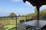 Enjoy breathtaking lake and mountain views from this stunning patio, perfect for al fresco dining or relaxing with a morning coffee.