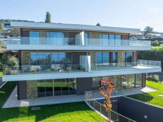 Experience modern luxury in this stunning multi-level residence featuring expansive glass balconies with breathtaking water views.