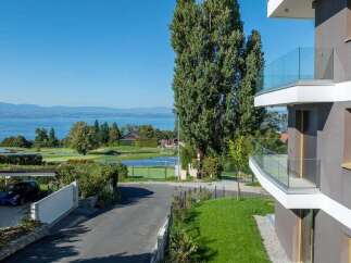 Experience luxurious living with stunning lake and golf course views from this modern apartment.