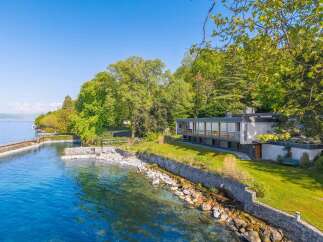 Experience luxury lakeside living in this stunning modern residence.