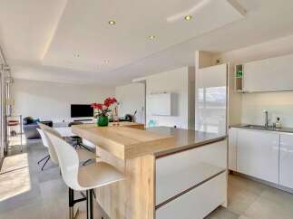 Experience modern living in this open-concept kitchen and living area, perfect for entertaining.