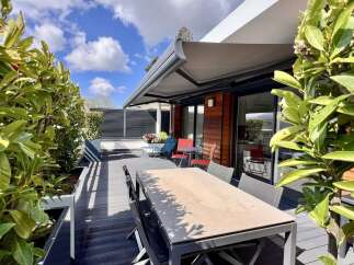 Enjoy outdoor living on this spacious rooftop terrace, perfect for entertaining or relaxing.