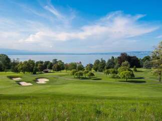 Experience luxury living with this stunning property offering breathtaking views of a serene lake and lush green golf course.
