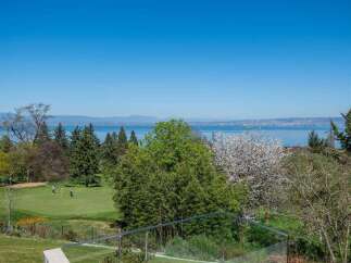 Enjoy breathtaking lake views from this stunning property, perfectly situated adjacent to a pristine golf course.