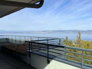 Enjoy breathtaking lake and mountain views from this expansive balcony, perfect for outdoor entertaining or quiet relaxation.