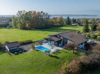 Experience luxury living in this stunning modern home featuring a private swimming pool and expansive outdoor entertaining areas.
