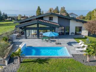 Experience modern luxury in this stunning home featuring a sleek design and a private backyard oasis.