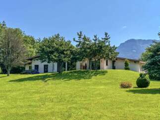 Nestled amidst lush greenery and rolling hills, this charming property offers a serene retreat with breathtaking mountain views.