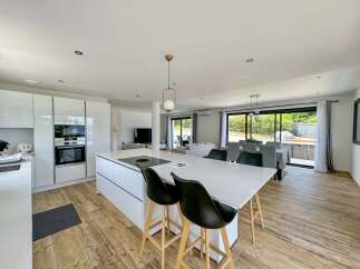 Experience modern living in this stunning open-plan kitchen and dining area.
