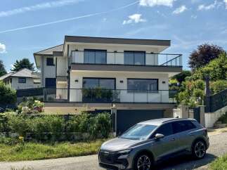 Discover this modern architectural gem featuring a sleek, multi-story design with expansive balconies and large windows that invite natural light.
