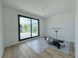 This room offers a dedicated space for your fitness journey, complete with a yoga mat, exercise ball, and a toning machine.