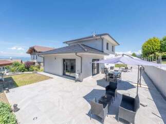 Experience modern living in this stunning home featuring a spacious patio perfect for outdoor entertaining.
