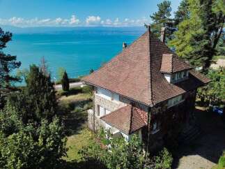 Experience breathtaking lake views from this charming property, perfectly situated to capture the serene waters and distant mountains.