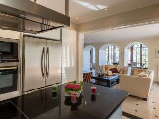 Experience modern luxury in this stunning kitchen and living area.