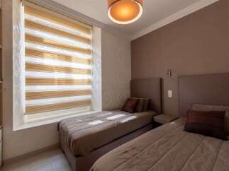 This charming hotel room features two comfortable twin beds, perfect for solo travelers or friends.