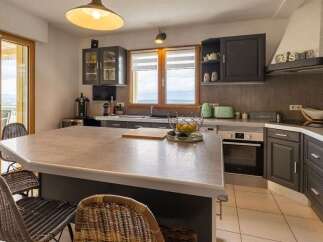 This modern kitchen features a large island with seating, perfect for casual dining and entertaining.