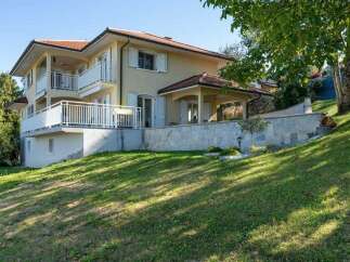 Discover this charming multi-level home, featuring expansive balconies perfect for enjoying the surrounding greenery and scenic views.