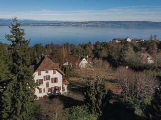 Nestled amidst lush greenery, this property offers breathtaking lake views and a serene atmosphere.