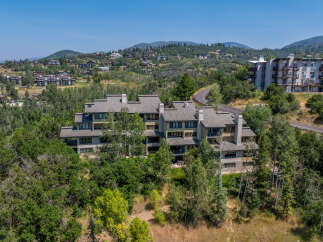 Nestled amidst lush greenery and rolling hills, this stunning property offers a serene mountain retreat.