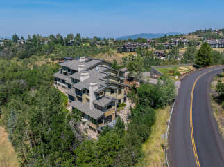 Discover luxury mountain living in this stunning multi-level townhome complex, nestled amidst lush greenery and rolling hills.