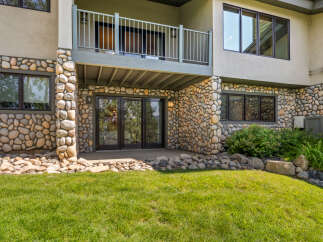 This home features a unique stone exterior, offering a rustic and natural aesthetic.
