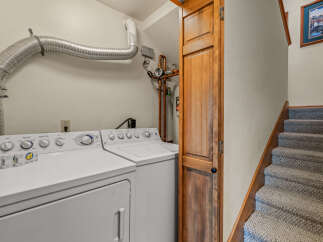 Discover the convenience of this dedicated laundry space, featuring a GE washer and dryer set ready for your household needs.