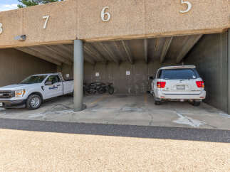 Discover convenient covered parking spaces, perfect for protecting your vehicles from the elements.