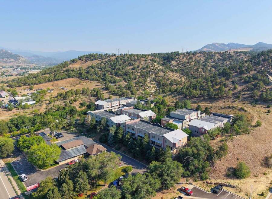 Discover modern living in this multi-unit complex nestled against a scenic hillside.