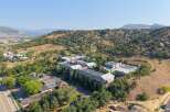 Discover modern living in this multi-unit complex nestled against a scenic hillside.