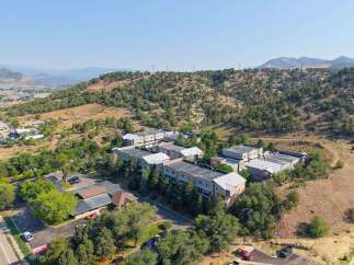 Discover modern living in this multi-unit complex nestled against a scenic hillside.
