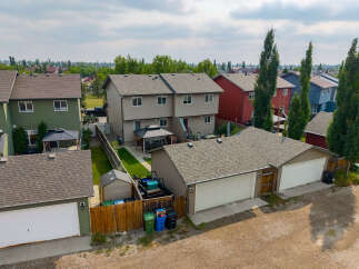 Discover this charming property featuring a spacious double garage with ample storage and a well-maintained backyard.