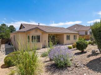 Discover this charming home with a spacious backyard, perfect for outdoor entertaining and relaxation.