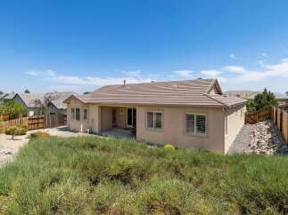 Discover this charming single-story home, featuring a spacious backyard with a covered patio perfect for outdoor entertaining.