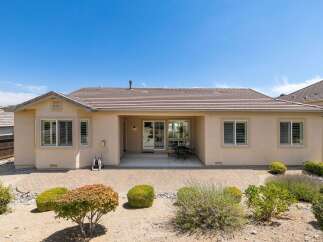 Enjoy outdoor living in this charming home featuring a spacious paver patio perfect for entertaining.